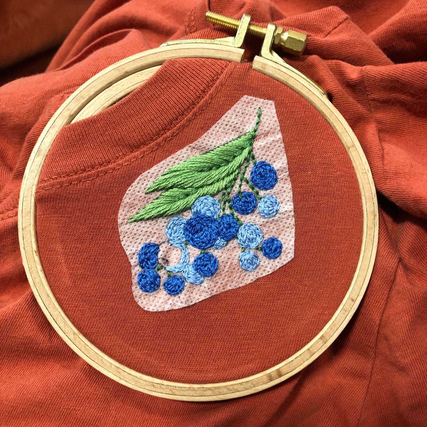 Example of Forest Forage Stick and Stitch Embroidery Patterns Embroidered on Sweatshirt